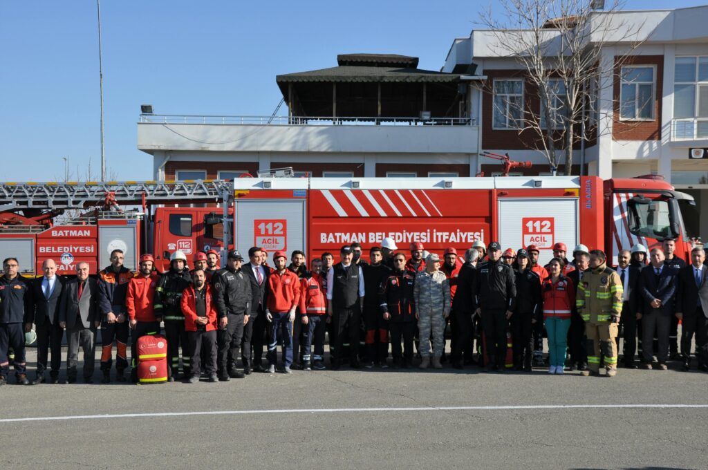 pexels-photo-26108515-26108515 Group of firefighters and officials posing in front of a fire truck in Batman, Türkiye.