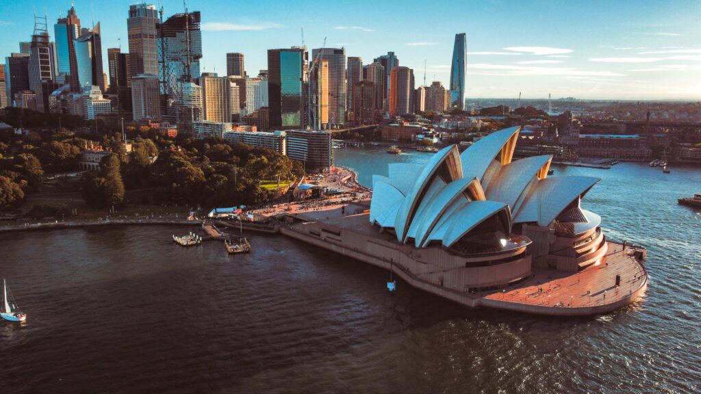 pexels-photo-7549817-7549817 Aerial view of Sydney Opera House with city skyline at sunset, Australia.
